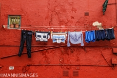 Laundry on Red Wall